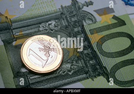 1-Euro coin laying on Euro notes Stock Photo