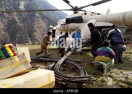 Distribution of relief items (shelter) by Helicopter through an aid organization in Palas Valley after the October 2005 Stock Photo