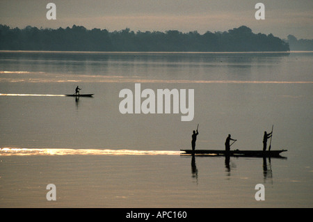 Pirogues dugouts at Sunrise Congo Zaire River D R Congo Central Africa Stock Photo