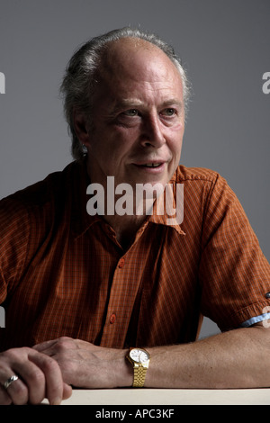 Waiting mature man sitting at table Stock Photo