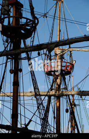 Masts and rigging of the Golden Hinde replica at Southwark on the River Thames, London, England Stock Photo