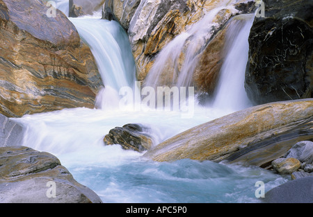 Cascades and colored coloured stones Verzasca valley Tessin Switzerland Stock Photo