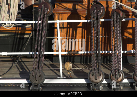 Detail of Shrouds showing Blocks at Deck level on Square Rigger in Charlestown Cornwall Stock Photo