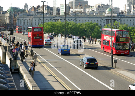 London Waterloo Bridge with pedestrians and free moving traffic Somerset House beyond Stock Photo