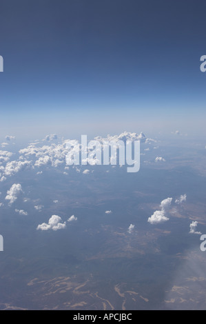 Airplane is flying above the clouds at sunset in summer. Landscape with ...