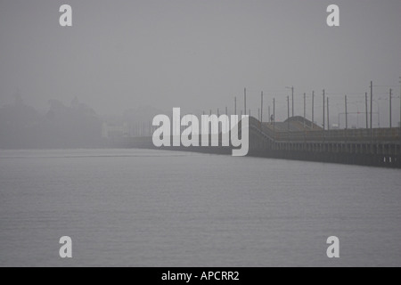 A foggy morning at the old Hornibrook Highway bridge Brighton Queensland Australia Stock Photo