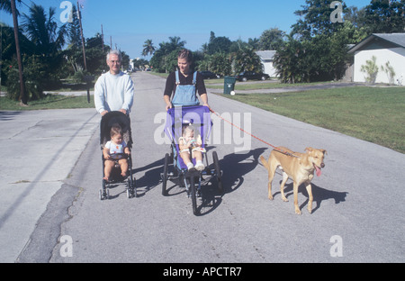 Family, with two babies and a dog, walking, Florida, USA Stock Photo