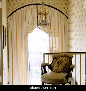 curtain treatment of double-height arched Georgian window in an Irish country house in Co. Louth Stock Photo
