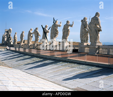 Statues of Christ, John the Baptist, and eleven of the apostles on the roof top St. Peter's Basilica, Vatican City Stock Photo