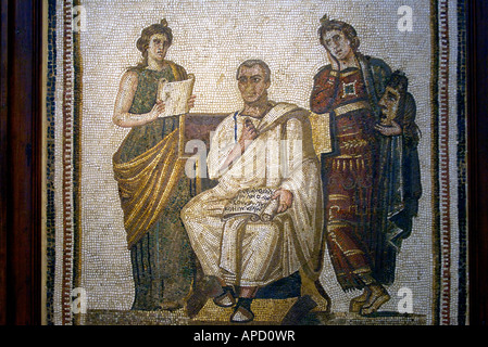 A mosaic of Virgil holding a volume of the Aenid flanked by the Muses Clio and Melpomene, in the Bardo Museum Stock Photo