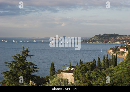 View south from Gargnano over Lake Garda Italy looking over a sailing regatta in summer Stock Photo