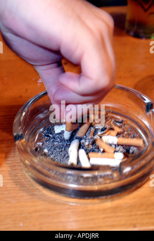 cigarette put out thing Putting out a cigarette Stock Photo