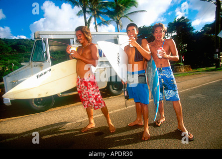 Young surfers eating shaved ice North Shore Hawaii USA Stock Photo