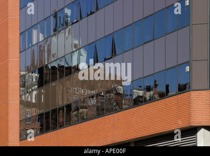 Grand Hotel reflected in windows of Harrogate International Conference Centre Harrogate North Yorkshire England Stock Photo