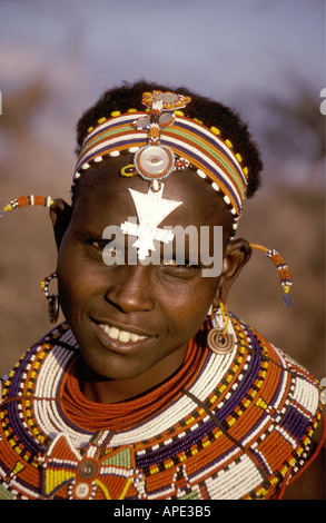 Young Samburu woman wearing traditional bead necklaces and ear ornaments Kenya Stock Photo