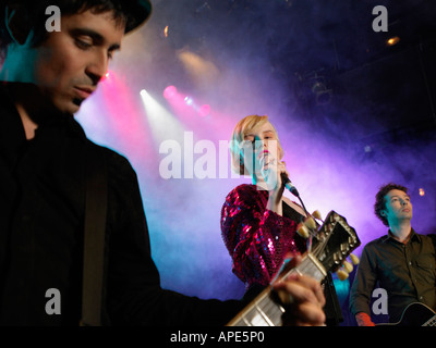 Rock band on stage in concert, low angle view Stock Photo