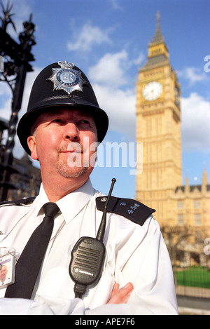 Police officer outside The Houses of Parliament showing Big Ben in ...