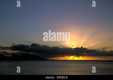 Dramatic golden sunset over lagoon, Tahiti Stock Photo