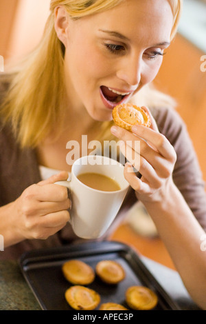 Woman eating mince pies Stock Photo