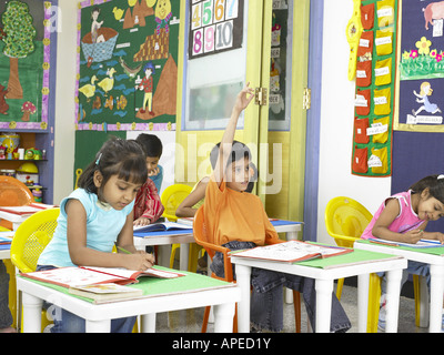South Asian Indian boys and girls studying in nursery school MR Stock Photo