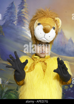 South Asian Indian boy dressed as lion performing fancy dress competition on stage MR Stock Photo