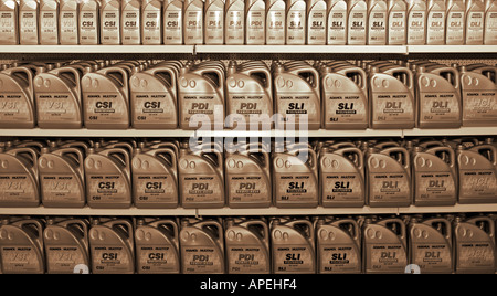 Bottles of Motor Oil on the Shelves of a Auto Parts Shop Stock Photo