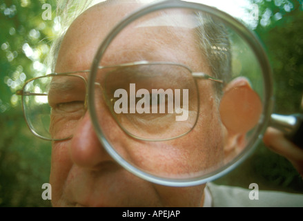 man & magnifying glass Stock Photo
