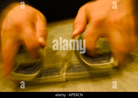 Closeup of a man's hands playing cards. Stock Photo