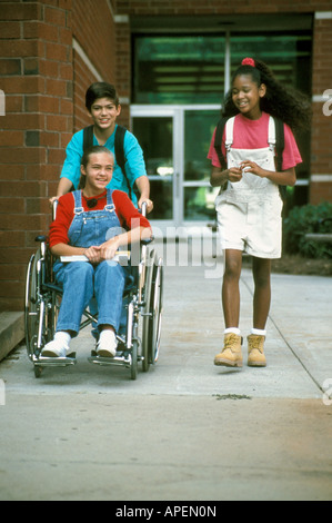 Handicapped girl with her friends. Stock Photo
