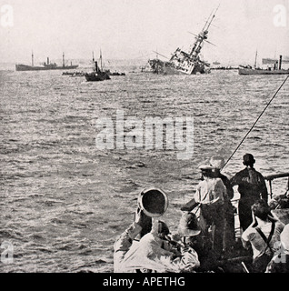 HMS Majestic sinking May 27, 1915 after being hit bya  torpedo off the Gallipoli Peninsula, Turkey during WWI. Stock Photo
