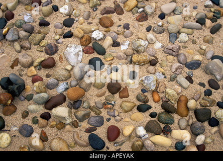 Pattern of Pebbles and Rocks in the Sand on a Beach on Lake Huron Forty Mile Point Michigan Stock Photo