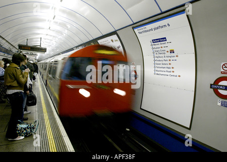 A London Underground train pulling into Oxford Street station Stock Photo