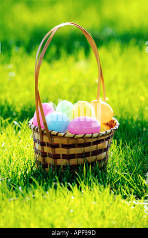 Easter egg basket full of colorful plastic easter eggs Stock Photo
