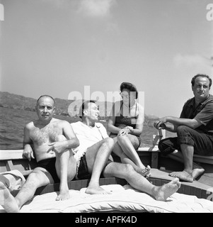 Isidro Bea Salvador Dali Gala and Arturo Caminada on a boat trip 1959 Stock Photo