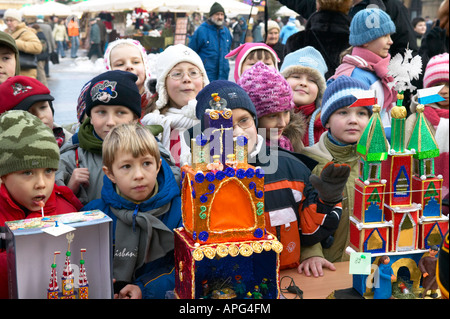 Poland Krakow Cracow Szopki Krakowskie annual Christmas crib making contest Polish School Children looking at entries Stock Photo
