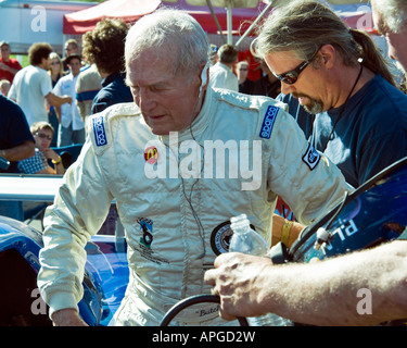 Paul Newman age 82 climbs out of racecar after winning at Lime Rock Park CT Sept 29 2007 Stock Photo