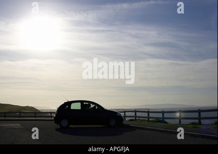 silhouette of car sitting in car park tourist amenity area on north antrim causeway coast county antrim northern ireland Stock Photo