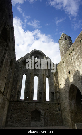 inside remains of 13th century cathedral against a blue cloudy sky in the Rock of Cashel Cashel Stock Photo