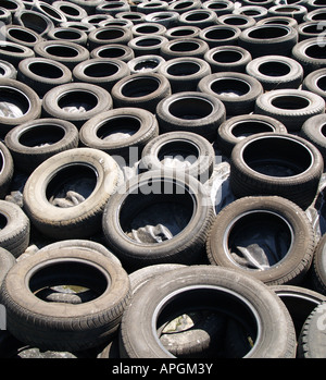 dump rubbish worn out used car tyres Stock Photo