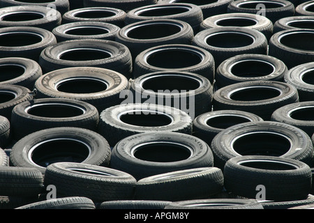 dump rubbish worn out used car tyres Stock Photo