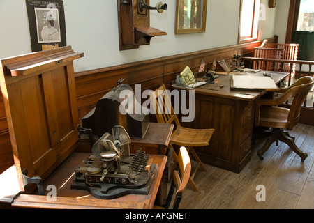 ILLINOIS Rockford Wooden desk with ledger typewriter old fashioned office in historic Midway Village Stock Photo