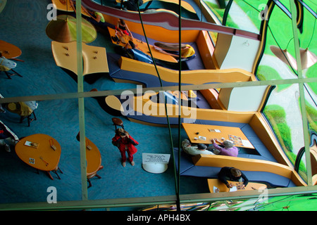 mirror image of photographer reflecting in bizarre distorted glass ceiling  South Island New Zealand Stock Photo