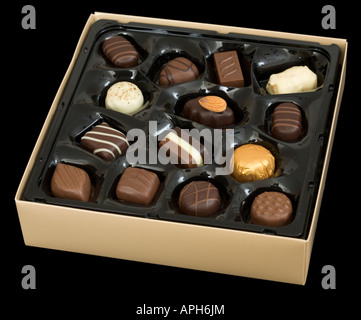 Gold-colored chocolate box isolated on black Stock Photo