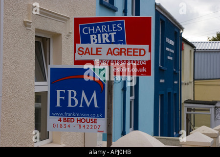 Estate agents signs and holiday homes for sale in Tenby Pembrokeshire Stock Photo