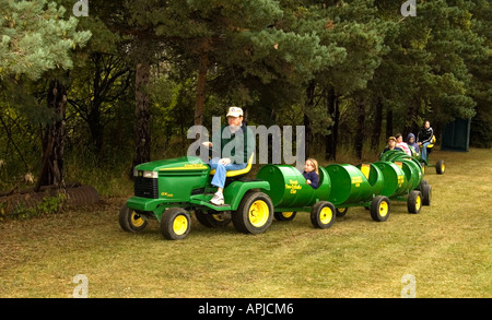 Kids Ride on Lawn Tractor with Trailers Stock Photo Alamy