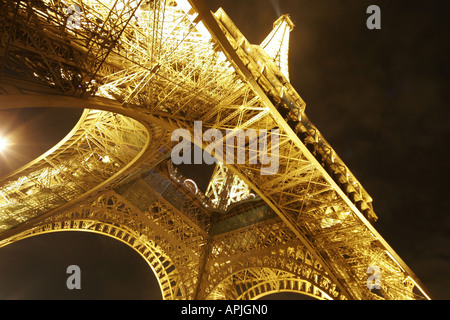 Eiffel Tower Tour Paris night lit up base close up Stock Photo