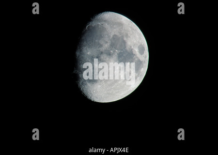 Three quarter full moon against black sky. Stock Photo