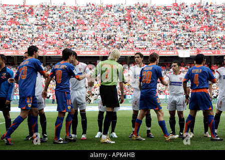 Sevilla FC and Valencia CF players shaking their hands Stock Photo