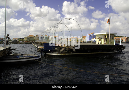 Willemstad's Punda waterfront floating pontoon footbridge for pedestrians crossing Sint Ana Baai entrance Stock Photo