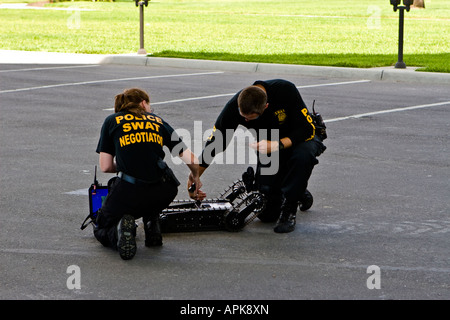 Police SWAT Negotiators Working on a Tactical Robot Stock Photo